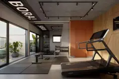 Academia com esteira, banco de musculação e aparelhos com decoração industrial — A1 Elementos da Terra em Coqueiros, Florianópolis