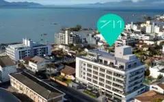 Vista aérea do empreendimento com pin de localização pela Baía Norte de Florianópolis — A1 Elementos da Terra em Coqueiros, Florianópolis