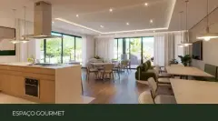 Espaço gourmet com ilha de cozinha, mesa de jantar, sofás verdes e janelas panorâmicas — Adore Cacupé em Cacupé, Florianópolis
