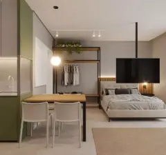 Studio com cozinha verde, mesa de jantar, closet aberto e cama de casal com TV — Adore Canasvieiras em Canasvieiras, Florianópolis