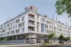 Fachada do edifício com varandas, térreo comercial com lojas e árvores na calçada — Adore Level Up em Cachoeira do Bom Jesus, Florianópolis