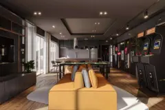 Salão de jogos com sofá amarelo, mesa de sinuca, cozinha e máquinas de fliperama — Adore Level Up em Cachoeira do Bom Jesus, Florianópolis