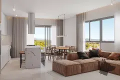 Sala de estar com sofá marrom, ilha de mármore, mesa de jantar e janelas para as montanhas — Adore Level Up em Cachoeira do Bom Jesus, Florianópolis