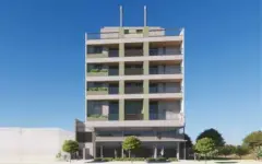 Fachada frontal pequena do edifício de 7 andares com entrada principal e jardins — Adore Smart Nova Cachoeira em Cachoeira do Bom Jesus, Florianópolis
