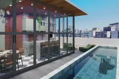 Perspectiva do terraço rooftop com piscina de azulejos verdes, cozinha gourmet interna envidraçada, poltronas e vista para os prédios do Centro de Florianópolis — Art Places em Centro, Florianópolis