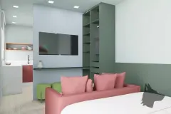 Perspectiva do studio com cama de casal, sofá rosa, TV embutida, closet verde aberto e cozinha ao fundo — Art Places em Centro, Florianópolis