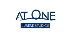 Logotipo do At One Jurerê Studios em azul e dourado em fundo branco — At One Jurerê Studios em Jurerê, Florianópolis