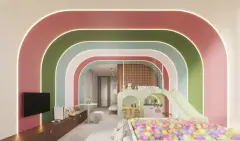Perspectiva da brinquedoteca com arcos coloridos em rosa, verde e azul, piscina de bolinhas coloridas, escorregador e beliche — Aura em Agronômica, Florianópolis