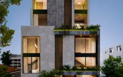 Perspectiva da fachada do edifício Aurum Blue View com jardins verticais, varandas e vegetação - ângulo alternativo — Aurum Blue View em Jurerê, Florianópolis