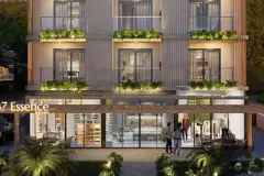 Perspectiva da fachada do B7 Essence Brava à noite com térreo comercial iluminado e varandas com vegetação - ângulo diferente — B7 Essence Brava em Praia Brava, Florianópolis