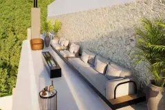 Perspectiva da área de estar no rooftop do B7 Essence Brava com sofá externo longo, lareira embutida e parede de pedra com vista para a mata — B7 Essence Brava em Praia Brava, Florianópolis