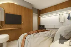 Perspectiva do quarto do apartamento do B7 Essence Brava com cama de casal, painel de TV em madeira, closet e penteadeira — B7 Essence Brava em Praia Brava, Florianópolis