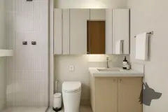 Perspectiva do banheiro do apartamento do B7 Essence Brava com box de vidro, vaso sanitário, bancada branca e gabinete — B7 Essence Brava em Praia Brava, Florianópolis