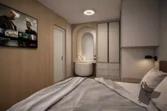 Dormitório com cama de casal, penteadeira embutida em arco e guarda-roupa cinza — Bella Sintra Residence em Estreito, Florianópolis