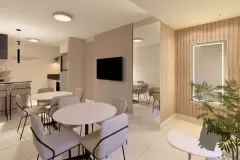 Salão de convivência com mesas redondas, cadeiras estofadas, TV e espelho grande — Bella Sintra Residence em Estreito, Florianópolis