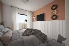 Dormitório com cama de casal, parede terracota, TV e varanda com cadeira ao fundo — Bella Sintra Residence em Estreito, Florianópolis