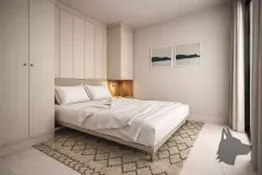 Dormitório com cama de casal, guarda-roupa branco embutido e quadros marinhos na parede — Bella Sintra Residence em Estreito, Florianópolis