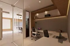 Home office com mesa em L, cadeira giratória e divisória de vidro para corredor — Bella Sintra Residence em Estreito, Florianópolis