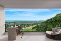 Varanda de apartamento com bancada em mármore, banquetas e sofá redondo, vista para o mar e mata — Bellomonte Residence em Ingleses, Florianópolis