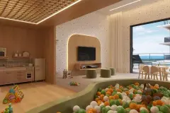 Brinquedoteca com piscina de bolinhas, parede em terrazzo, cozinha infantil, TV embutida e vista para o mar — Bellomonte Residence em Ingleses, Florianópolis