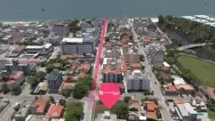 Vista aérea do bairro Canasvieiras com pin de localização do BG Connect Canas, praia e lagoa ao fundo — BG Connect Canas em Canasvieiras, Florianópolis