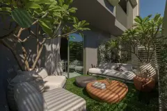 Garden privativo com sofás brancos modulares, mesa redonda e árvores de frangipani ao lado do apartamento — BG Connect Canas em Canasvieiras, Florianópolis