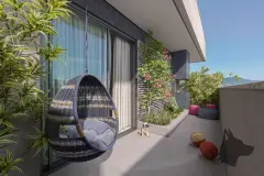 Varanda com poltrona suspensa de vime, plantas, puf colorido e bolas de basquete no chão — BG Connect Trindade 2 em Trindade, Florianópolis