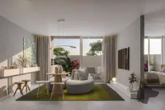 Sala integrada com sofá curvo cinza, mesa redonda, TV na parede e varanda com jardim ao fundo — Brisa do Leste Residence em Barra da Lagoa, Florianópolis