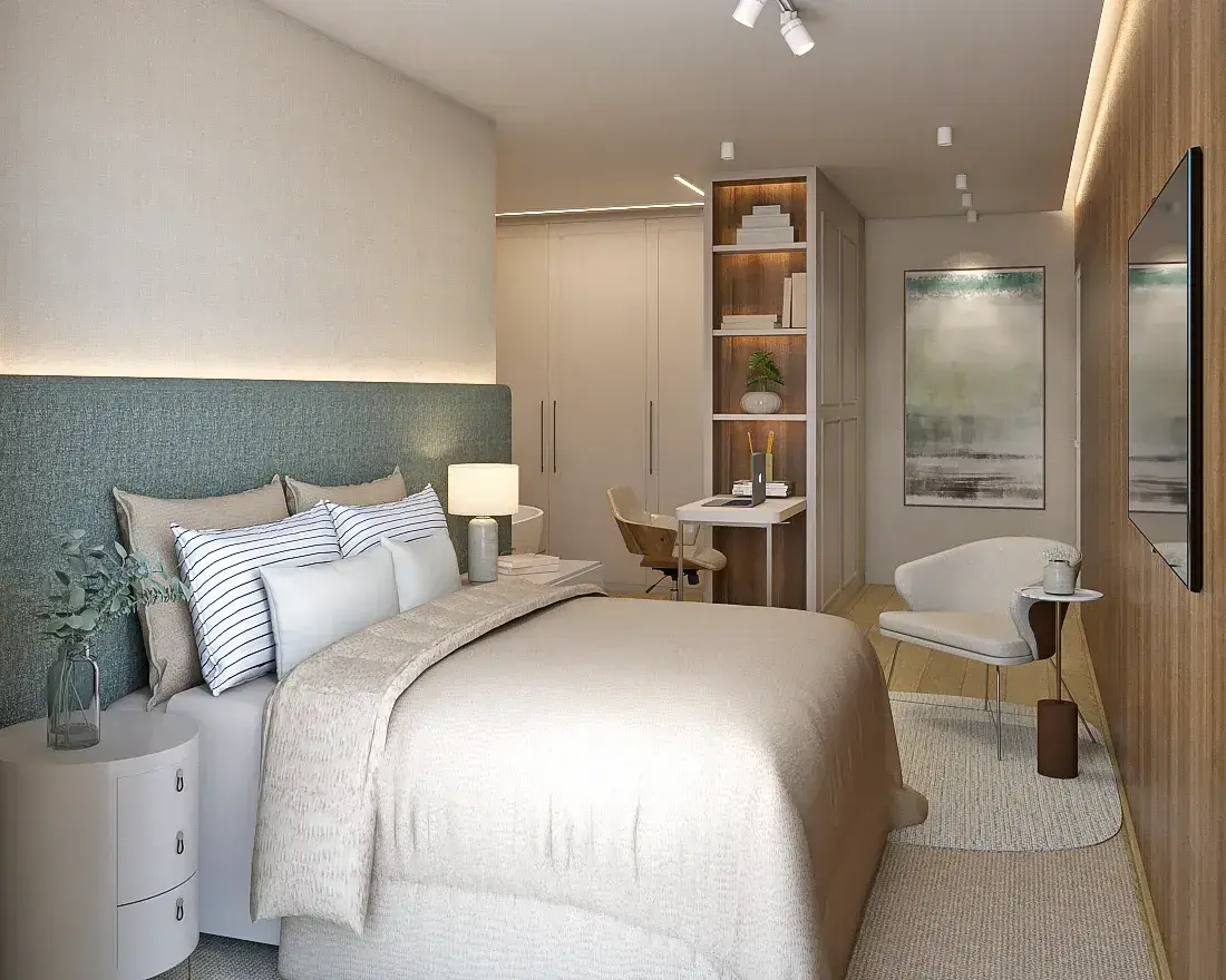 Suíte com cama de casal, cabeceira estofada em verde, guarda-roupa embutido, home office integrado, poltrona e TV — Cacupé 4 Náutico Residence em Cacupé, Florianópolis