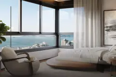 Suíte premium do Cais by Nova com cama de casal, poltrona boucle, janelões de canto com vista para a Baía Sul — Cais by Nova em Centro, Florianópolis