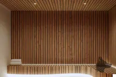 Perspectiva ilustrativa da sauna com banco e revestimento em ripas de madeira clara cobrindo parede e teto — D/Season Residence Club em João Paulo, Florianópolis