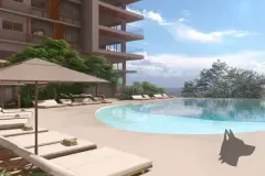 Perspectiva ilustrativa da piscina infinity com espreguiçadeiras e guarda-sol ao pé do edifício de 10 andares — D/Season Residence Club em João Paulo, Florianópolis