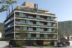 Perspectiva da fachada do Dália Canasvieiras com sacadas com vegetação, logotipo na cobertura — Dália em Canasvieiras, Florianópolis