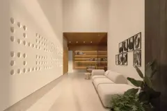 Perspectiva do lobby do Djalma 64 com sofá, estante iluminada e parede com relevo circular decorativo — Djalma 64 em Centro, Florianópolis