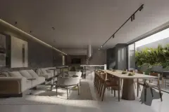 Perspectiva do salão de festas com sala de estar, mesa longa de jantar e cozinha com jardim ao fundo — Domus 544 em Agronômica, Florianópolis