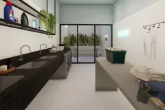 Lavanderia compartilhada com bancada de granito preto, pias, máquinas de lavar, letreiro Wash neon e cabideiro — Easy Studios em Centro, Florianópolis