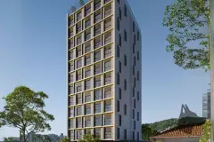 Fachada diurna do edifício Easy Studios com revestimento em grade dourada e Morro da Cruz ao fundo — Easy Studios em Centro, Florianópolis