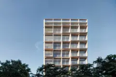 Perspectiva frontal do Edifício Teahupoo em Santa Mônica com varandas amplas e revestimento amadeirado — Edifício Teahupoo em Santa Mônica, Florianópolis