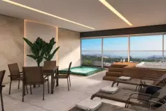 Perspectiva da área de lazer com jacuzzi, mesa e espreguiçadeiras do Essência Carlessi com vista para as montanhas — Essência Carlessi em Córrego Grande, Florianópolis