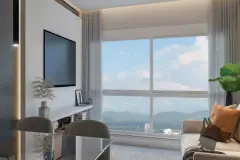 Perspectiva da sala de estar do Essência Carlessi com sofá amplo cinza, mesa de jantar e vista para a sacada com montanhas — Essência Carlessi em Córrego Grande, Florianópolis