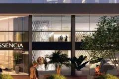 Perspectiva da portaria envidraçada do Essência Carlessi à noite com logotipo e hall de entrada iluminado — Essência Carlessi em Córrego Grande, Florianópolis