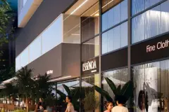 Perspectiva da fachada comercial noturna do Essência Carlessi com lojas e coffee shop ao nível da rua — Essência Carlessi em Córrego Grande, Florianópolis