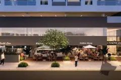 Perspectiva da calçada comercial noturna do Essência Carlessi com lojas Health Care e Coffee Shop em fachada de vidro — Essência Carlessi em Córrego Grande, Florianópolis