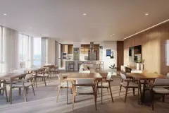 Salão de festas amplo com mesas e cadeiras em madeira, cozinha gourmet ao fundo e janelas para o mar — Galleria 50 em Jurerê, Florianópolis