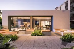 Área de convivência externa ao entardecer com sofás, fogão de lenha, fire pit e jardim com plantas — Gran Malltech Residence em Vargem Grande, Florianópolis