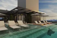Piscina no rooftop com espreguiçadeiras e guarda-sol, vista para montanhas e Baía Sul ao entardecer — HUB Beira Mar em Saco dos Limões, Florianópolis