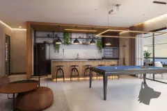 Salão de festas com mesa de sinuca, cozinha gourmet, banquetas industriais e pendentes decorativos — HUB Beira Mar em Saco dos Limões, Florianópolis