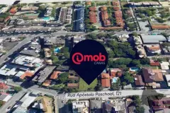 Vista aérea do terreno na Rua Apóstolo Paschoal, 121, em Canasvieiras, com pin do empreendimento — Imob Canas em Canasvieiras, Florianópolis