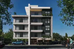 Fachada frontal do edifício de 5 andares com revestimento em mármore, varandas amplas e área de convivência com guarda-sóis — Imperial Residence em Campeche, Florianópolis