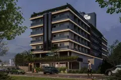 Fachada noturna do edifício com logotipo CX8 luminoso, carros estacionados e pedestre na calçada — Infinite Campeche em Campeche, Florianópolis